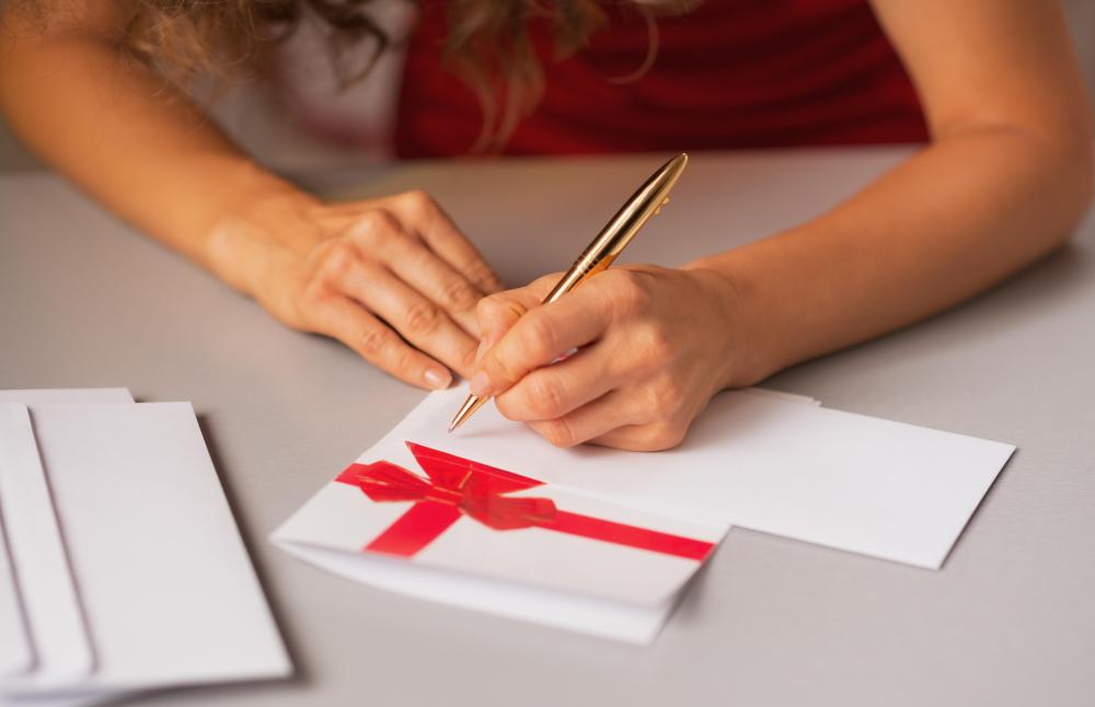 woman writing christmas cards